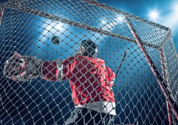 Ice Hockey goalie saves a goal