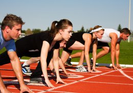 Five runners lined up ready to race